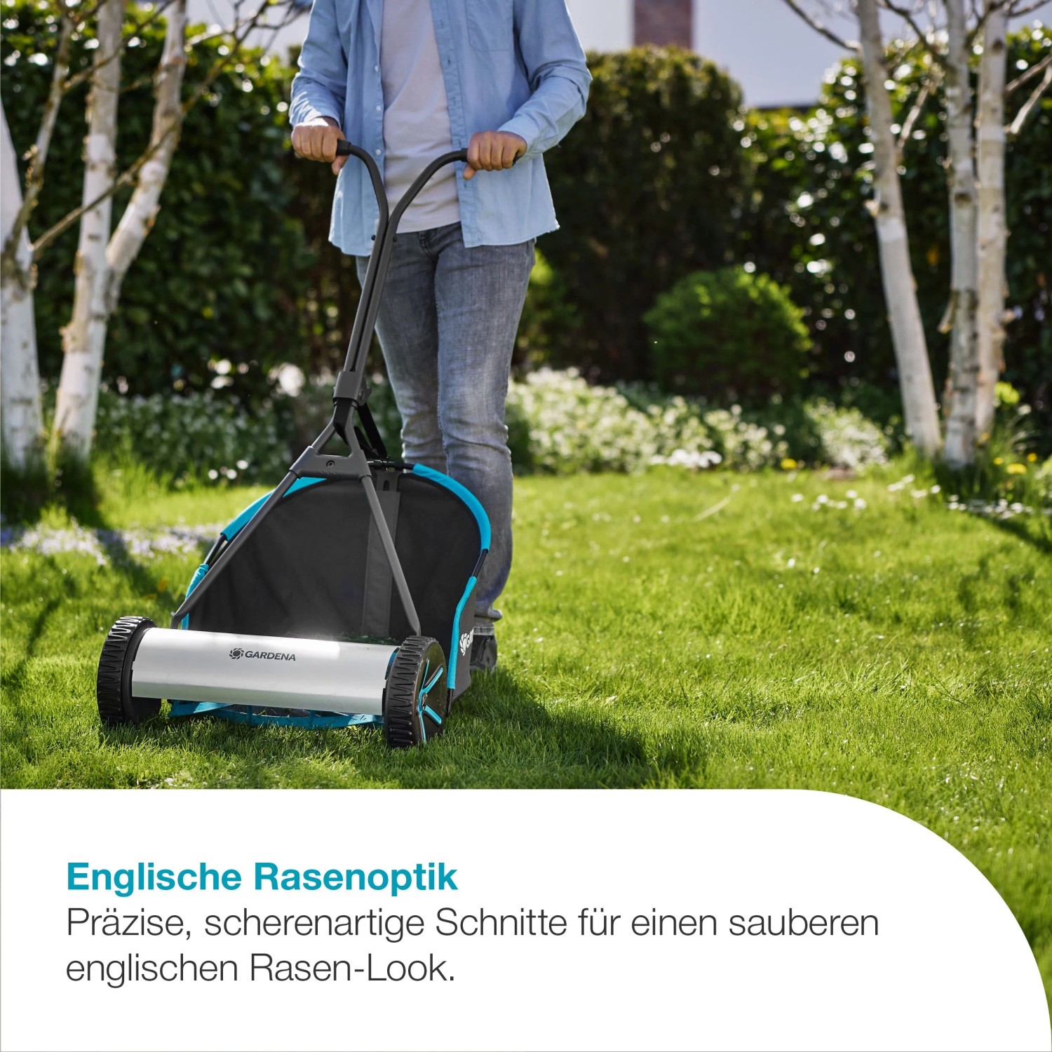 Gardena Spindelmäher Plus 400 mit Fangkorb im Einsatz auf Rasenfläche.