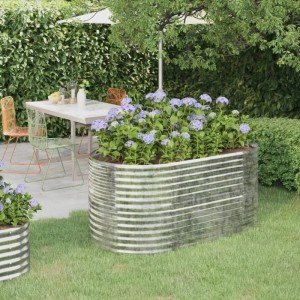 Silbernes, ovales vidaXL Hochbeet aus verzinktem Stahl (152x80x68 cm) mit Hortensien im Garten.