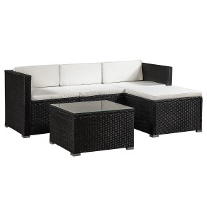 Schwarze Polyrattan Lounge Punta Cana mit creme Bezügen, bestehend aus Sofa, Hocker und Tisch mit Glasplatte.