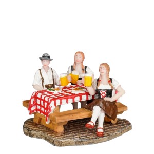 Luville Collectables Weihnachtsdeko: Drei Figuren in Tracht am Tisch mit Schnitzel und Bierkrügen. Lebendige Restaurant-Szene.