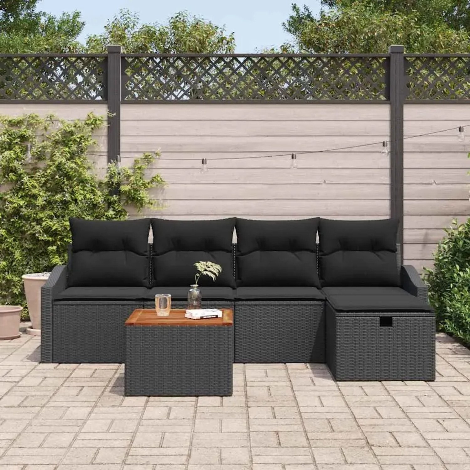 Schwarzes 6-teiliges Garten-Sofa-Set aus Poly Rattan mit Kissen und Tisch für Terrasse und Garten.