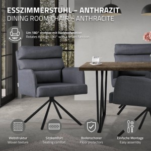 Anthrazitfarbener Esszimmerstuhl mit 180° drehbarer Rückenlehne, Armlehnen und Polyesterbezug auf schwarzem Stahlgestell.