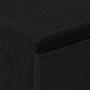 Detailaufnahme: Schwarzes Sideboard in Eichen-Optik mit Schublade.