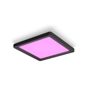 Quadratisches Philips Hue LED Panel Tento in Schwarz mit pinkfarbenem Licht.