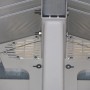 Grosfillex Verankerungskit für Gartenhaus, Detailansicht der Stahlseil-Befestigung.