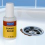 Wenko Emaille-Fix Lack 20ml Flasche neben einem reparierten Abfluss in einem Waschbecken.