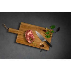 Nirosta Kochmesser Trinity auf Holzbrett mit Steak, Kräutern und Gewürzen.