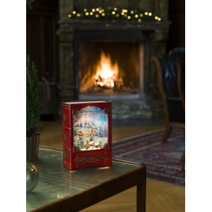 Konstsmide LED Wasserlaterne in Buchform mit Schneeflocken und Weihnachtsszene, warmweißes Licht.