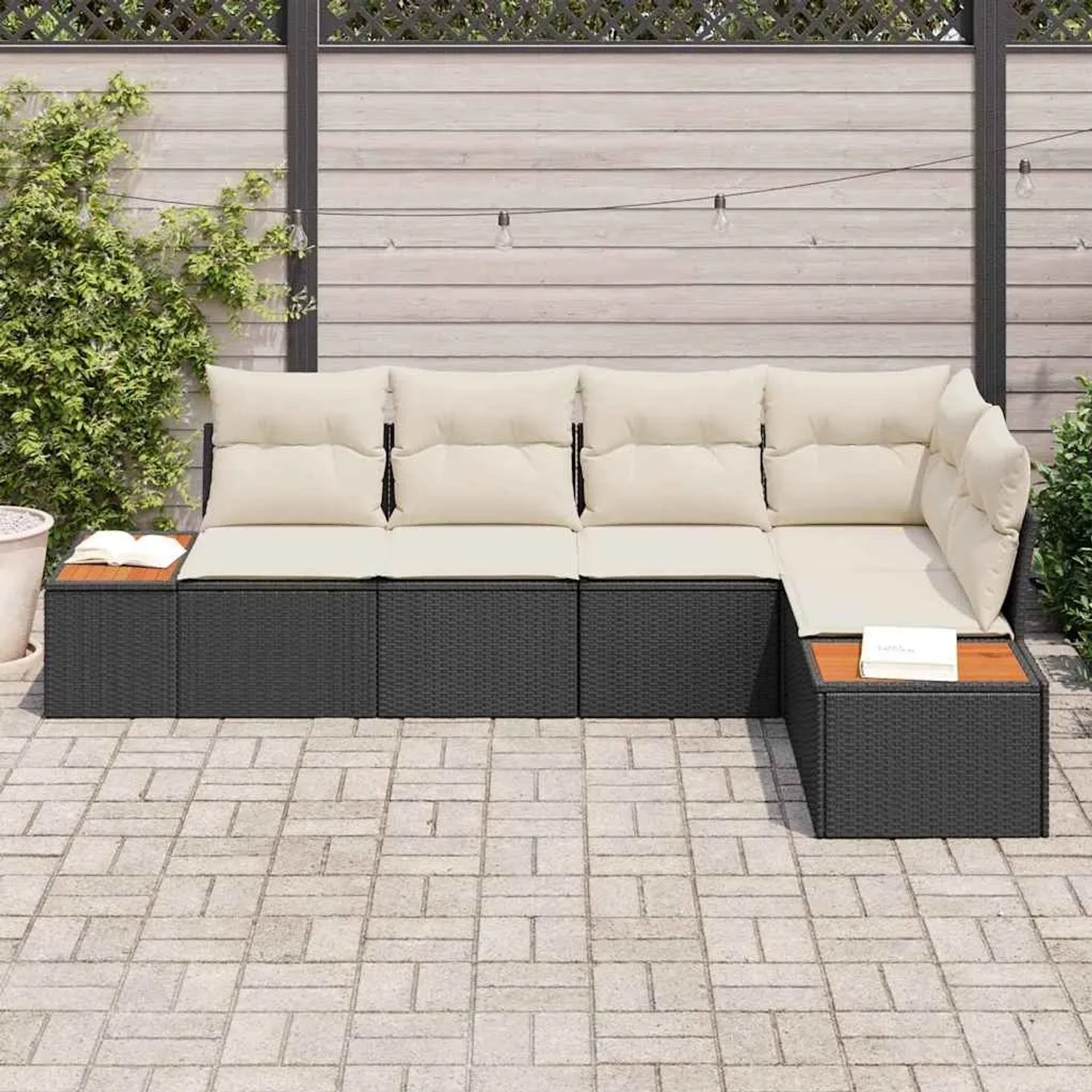 Schwarzes 5-teiliges vidaXL Garten-Sofa-Set aus Polyrattan mit Kissen.