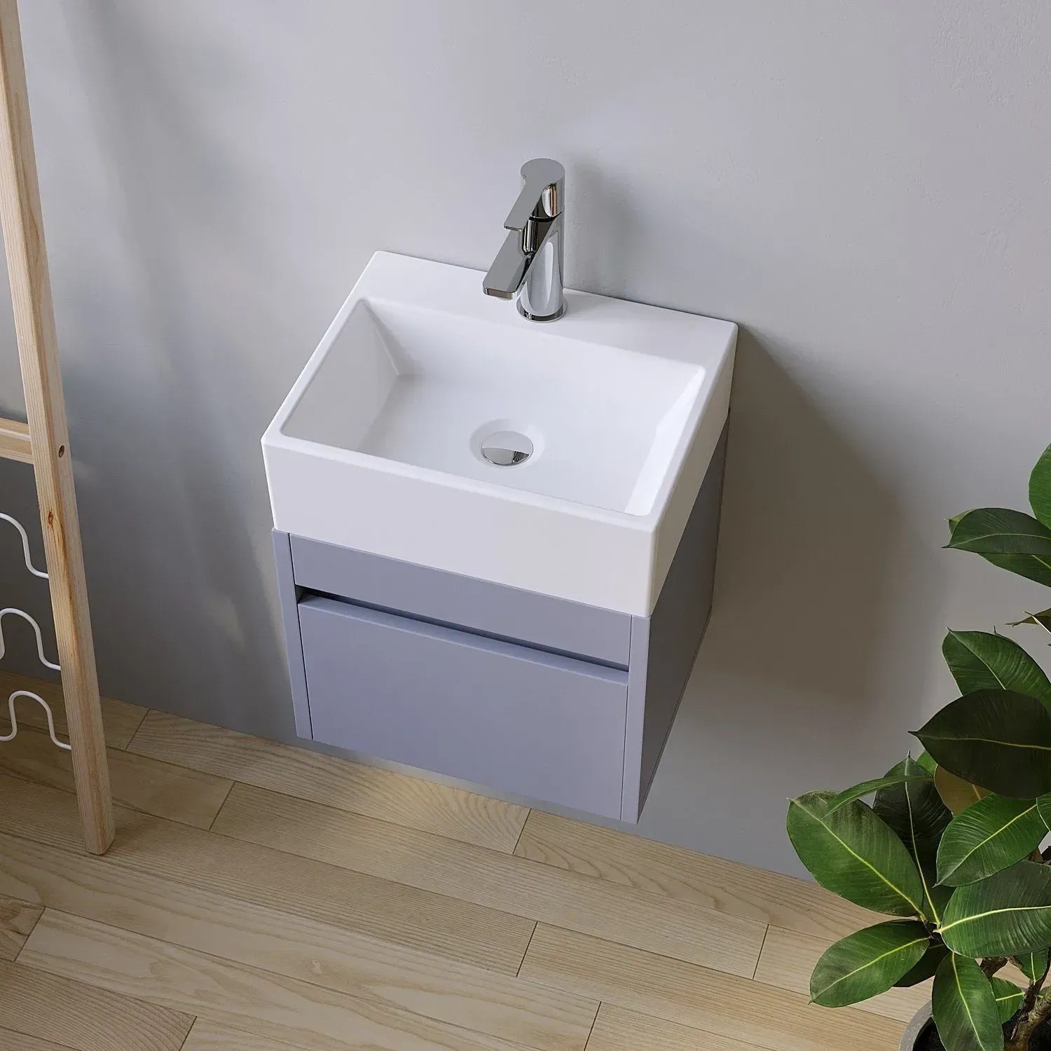 Rechteckiges, weißes Aufsatzwaschbecken mit Armatur und Unterschrank in Grau. Ideal für kleine Bäder.