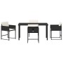 Schwarze 5-tlg. vidaXL Garten Essgruppe aus Poly Rattan mit Tisch und Stühlen inklusive Kissen.