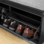 Schwarze SoBuy Sitzbank FSR64-SCH mit Sitzkissen und Schuhen in den Kippfächern.