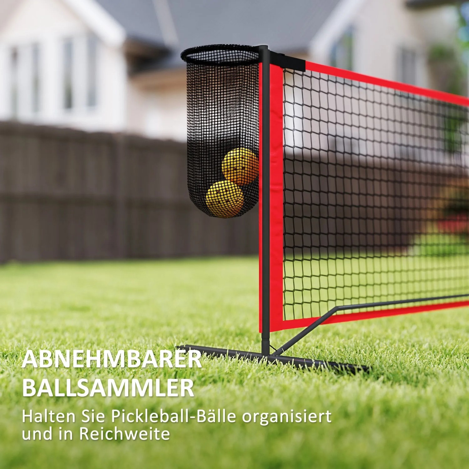 SPORTNOW Pickleball Netz in Schwarz-Rot mit abnehmbarem Ballkollektor, gefüllt mit gelben Bällen, auf grünem Rasen.