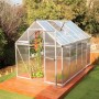 CANOPIA Gewächshaus Mythos Silber 5,7 m² mit Fundamentrahmen, auf Holzterrasse im Garten.