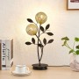 Schwarze Lucande Tischlampe Evory mit zwei floralen Lampenschirmen aus Metall für das Wohnzimmer.