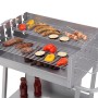 Silberner tepro Grillwagen Pasadena Holzkohlegrill mit Grillgut auf zwei Ebenen.