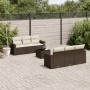 Braune 7-tlg. vidaXL Garten-Sofagarnitur aus Poly Rattan mit cremeweißen Kissen im Garten.