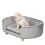 Graues PawHut Hundesofa aus Samt mit kleinem, weißen Hund.