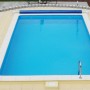 Steinbach Styropor Pool-Set Eco mit Leiter und blauem Wasser im Garten.