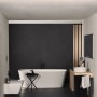 Ideal Standard Ceraline Waschtischarmatur in Schwarz mit verlängertem Sockel in einem modernen Badezimmer.