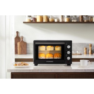 Schwarzer Steinborg Minibackofen SB-3002 mit Umluft und Muffins im Garraum.