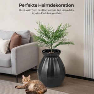 Schwarze Costway Katzentoilette in Blumentopf-Optik mit Pflanze und Katze im Wohnzimmer.