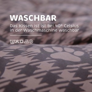Detailaufnahme: Waschbares, braunes Hundekissen/Hundebett mit Pfotenmuster.