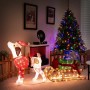 Beleuchteter Deko-Hund mit Schlitten und Geschenken als festliche Weihnachtsdekoration.