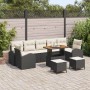 Schwarzes 10-teiliges vidaXL Garten-Sofa-Set aus Poly Rattan mit Tisch und Kissen.