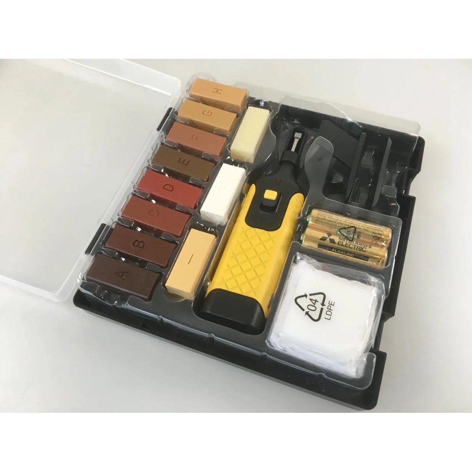 Westfalia Reparatur-Set für Laminat & Parkett. Offener Koffer mit 11 farbigen Hartwachsstangen, Heizgerät & Zubehör.