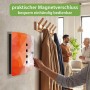 Hand öffnet Banjado Design Schlüsselkasten aus Edelstahl mit orangefarbenem Polygon-Motiv. Magnetverschluss für Garderoben.