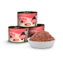 Lucky Lou Katzen-Nassfutter Kitten Geflügel, 200g Dosen und eine Schale mit Futter.