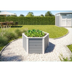 Graues Weka 6-Eck Elementhochbeet 669 (143x120x68,5 cm) im Garten mit Pflanzen.