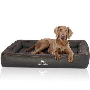 Knuffelwuff Hundebett Montego, orthopädisches Kunstleder-Hundekörbchen in Schwarz mit Hund.