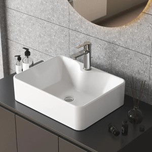 Rechteckiges, weißes Aquabatos Aufsatzwaschbecken aus Keramik auf Badmöbel.