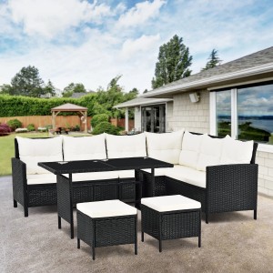 Schwarze Polyrattan Gartenlounge Manacor mit creme Bezügen, bestehend aus Sofa, Tisch und Hockern.