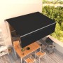 Anthrazitfarbene, automatische Markise 4x3 m mit Volant für Terrasse oder Balkon.
