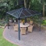 Anthrazitfarbener Palram Canopia Palermo Gartenpavillon 3x3 m mit LED-Set und Sitzgruppe.