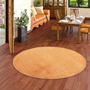 Runder, terrakottafarbener Snapstyle Hochflor Teppich Luna, 100cm Durchmesser.
