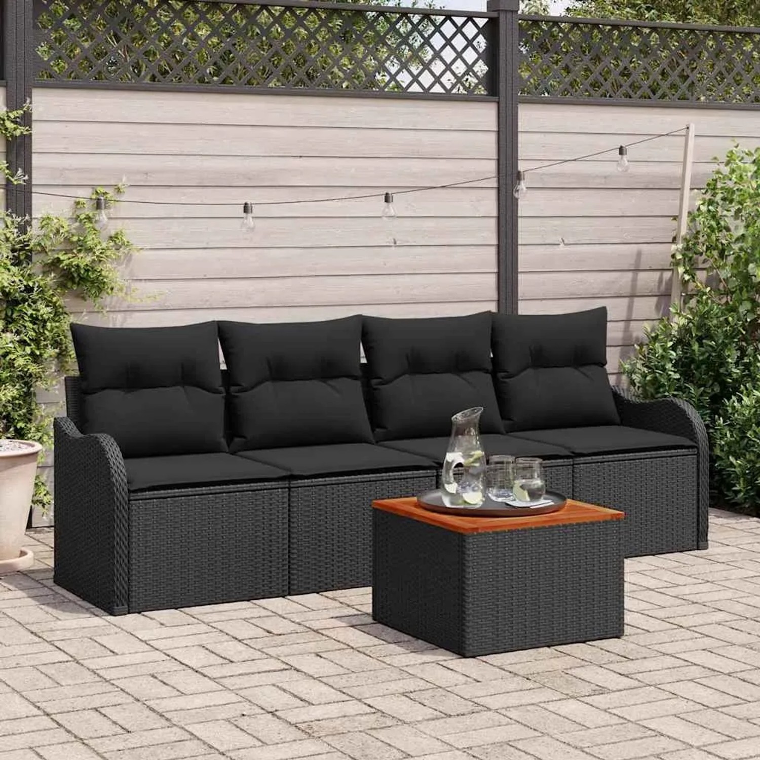Schwarzes 5-teiliges vidaXL Garten-Sofa-Set aus Poly Rattan mit Tisch und Stauraum.