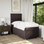 Dunkelbraunes Boxspringbett 90x190 cm mit Matratze und Kopfteil im Schlafzimmer.