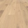 Helle Landhausdielen aus Eichenparkett mit strukturierter Oberfläche und Öl/Wachs-Finish.