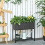 Outsunny Blumenkasten aus Rattan mit Füßen und Ablage, bepflanzt mit Blumen.