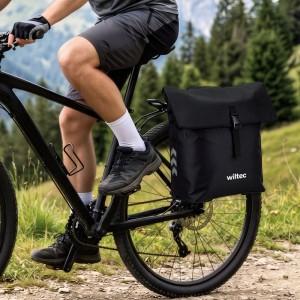 Schwarze Wiltec Fahrrad-Trolley Gepäckträgertasche 28L aus Polyester am Fahrradheck, beim Radfahren.