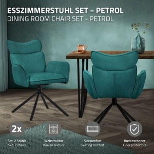 Zwei petrolfarbene drehbare Esszimmerstühle mit Stoffbezug und schwarzen Metallbeinen in modernem Esszimmer.