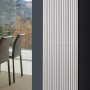 Weißer Ximax Raumheizkörper Triton (1800x330mm) mit Mittenanschluss im modernen Wohnraum.