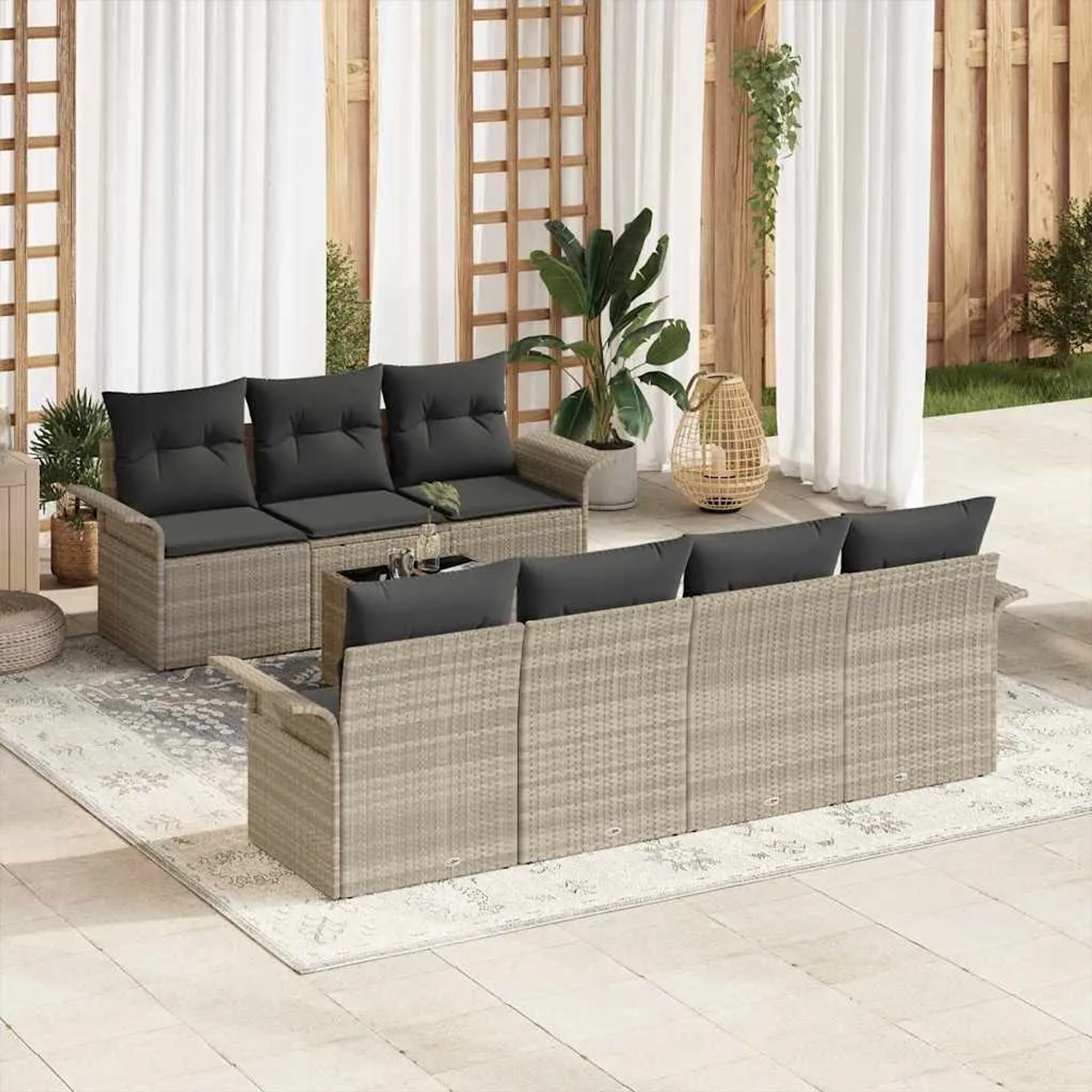 Hellgraue 8-tlg. vidaXL Garten-Sofagarnitur aus Poly Rattan mit anthrazitfarbenen Kissen.