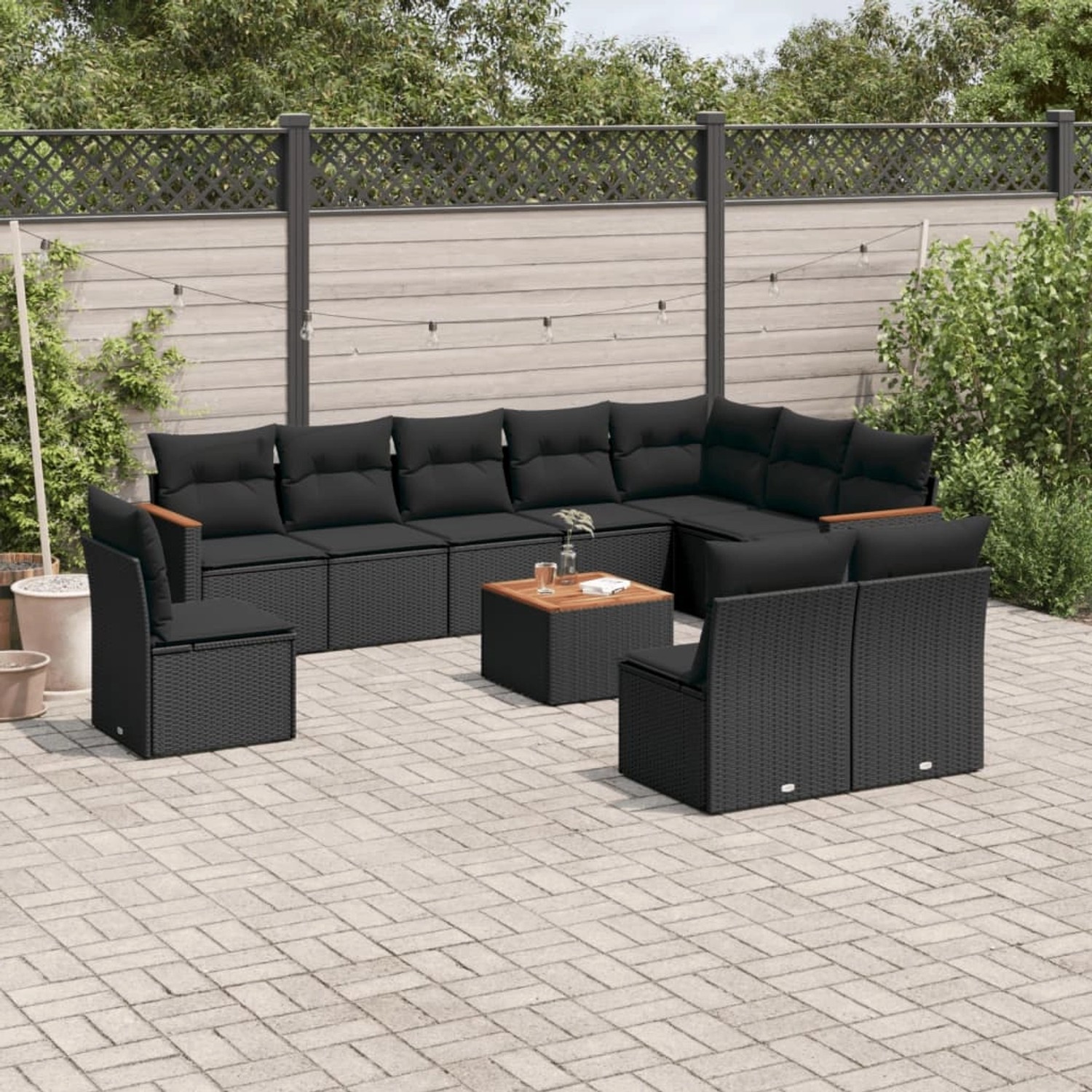 Schwarze 11-tlg. vidaXL Garten-Sofagarnitur aus Poly Rattan mit Kissen und Tisch.