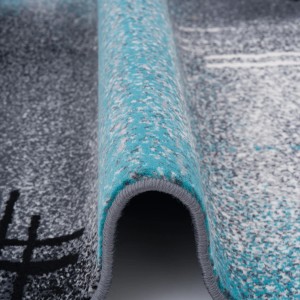 Detailansicht: Blauer Designer Teppich Brilliant mit Farbverlauf, 80x150cm. Kurzflorteppich mit modernem Muster.