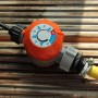 Bewässerungsuhr für Gewächshaus Calypso: Orangefarbener Regler mit Schlauchanschluss.